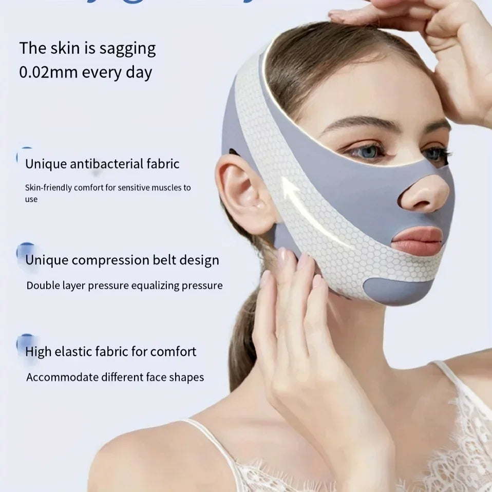A woman wearing a grey, elastic, V-line face slimming bandage with a honeycomb texture around the jawline.