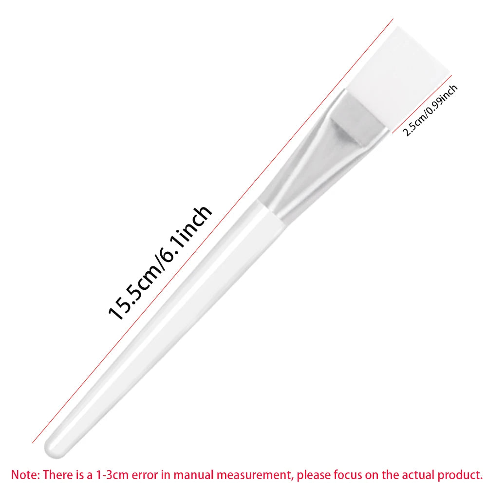 A transparent facial mask applicator brush with a white silicone head and 15.5cm total length.