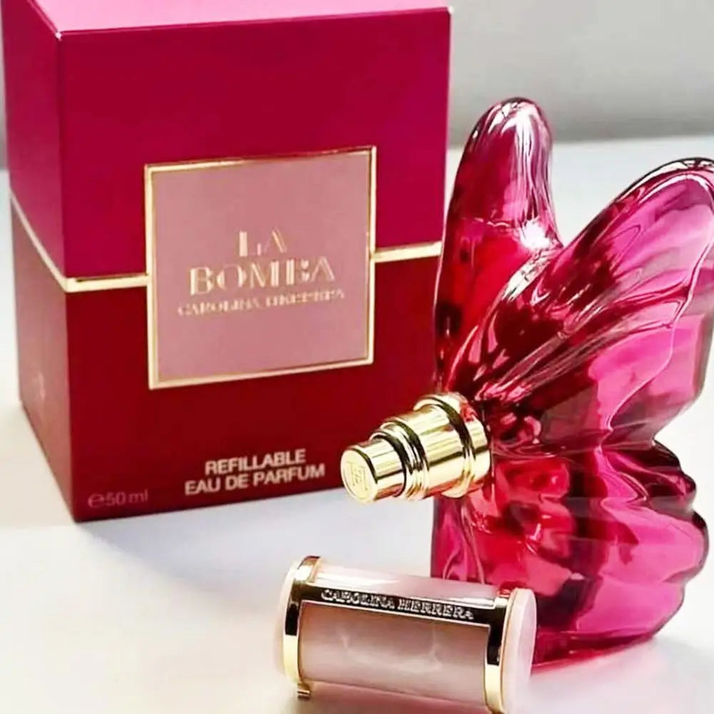 Carolina Herrera La Bomba EDP: Pink butterfly-shaped bottle, luxury women's floral fruity perfume in display box.