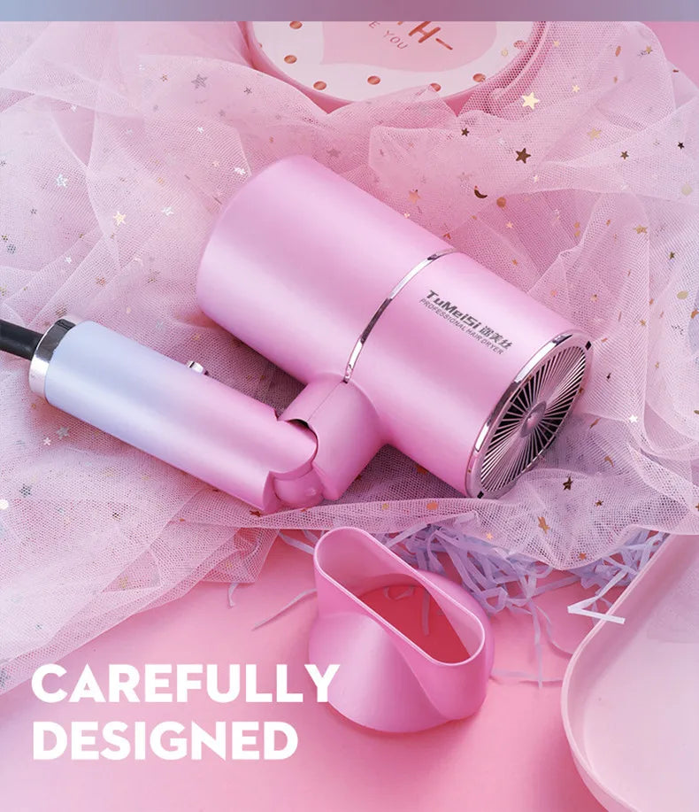 Pink foldable mini hair dryer with nozzle attachment, ion technology, and quick-drying power for travel.