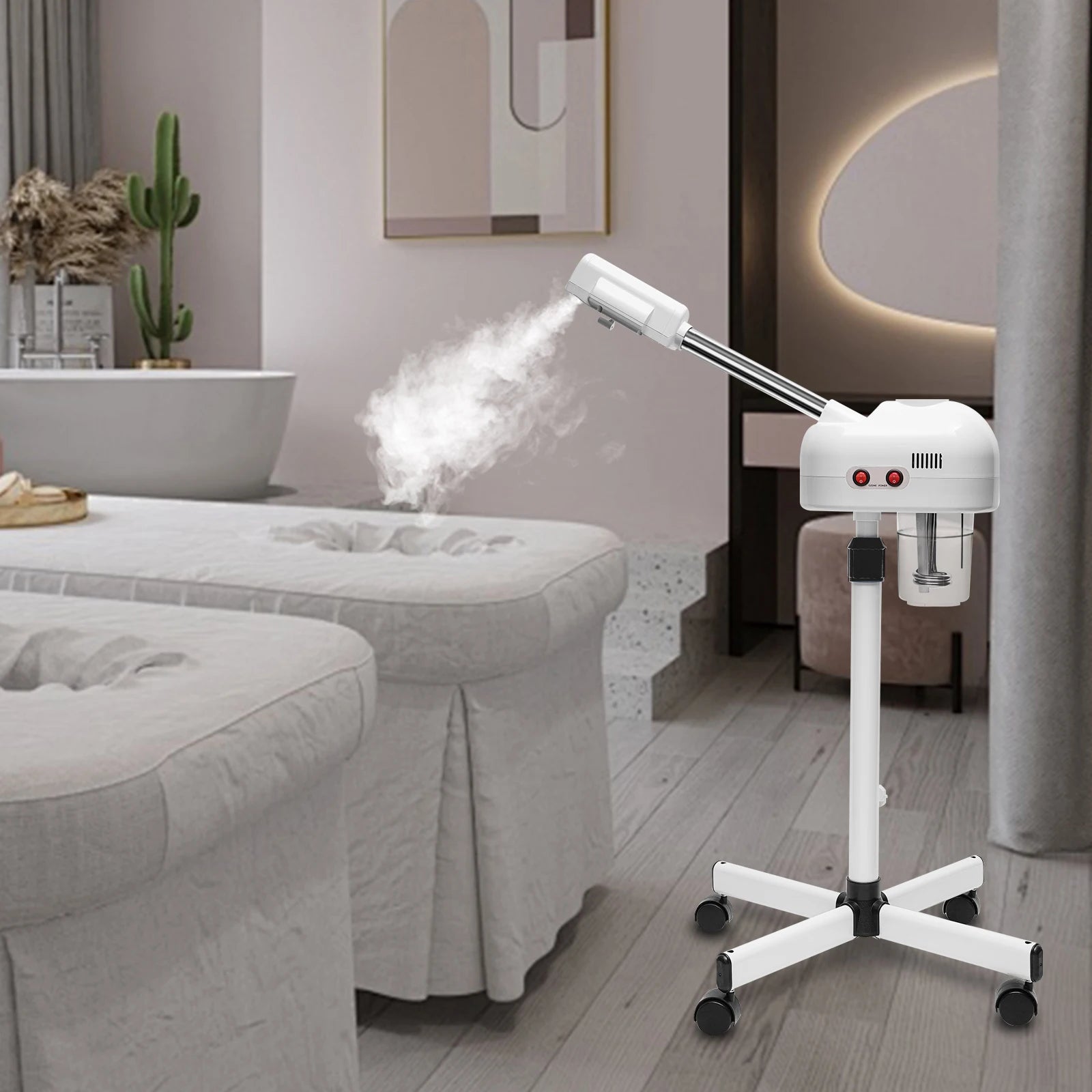 White 800W professional facial steamer on wheels with 750ml tank, emitting steam in a modern spa treatment room.