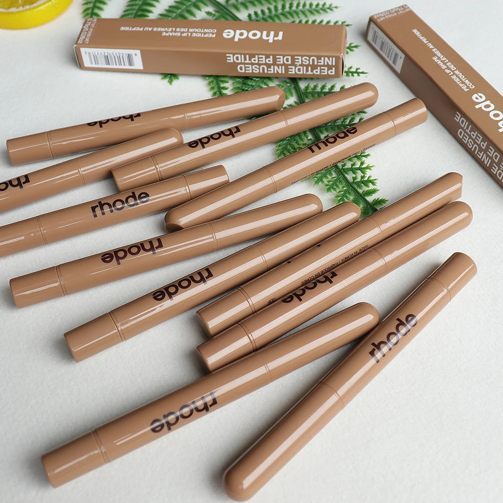 Rhode Skin Peptide Lip Shape liner pens in sleek nude beige tubes with branded packaging on a white surface.
