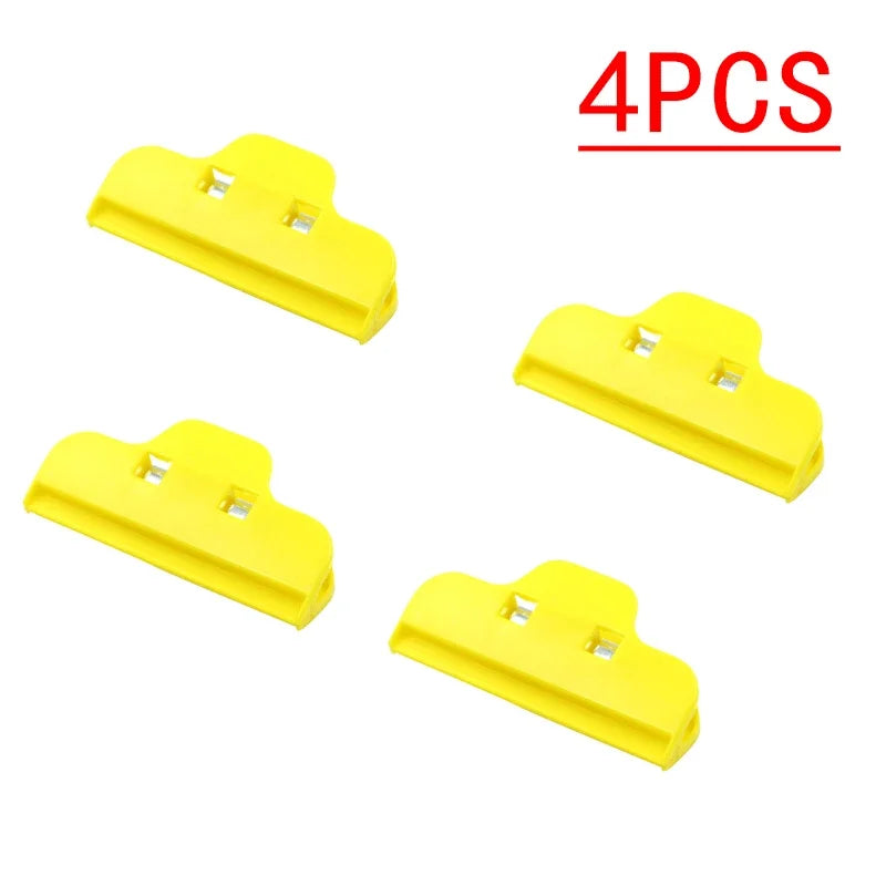 Set of four yellow plastic Tidesmit screen repair fixture clamps with a flat, clip-style design for electronic devices.
