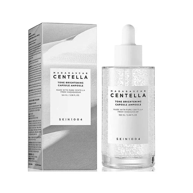 Tone brightening capsule ampoule bottle with white dropper and matching box.
