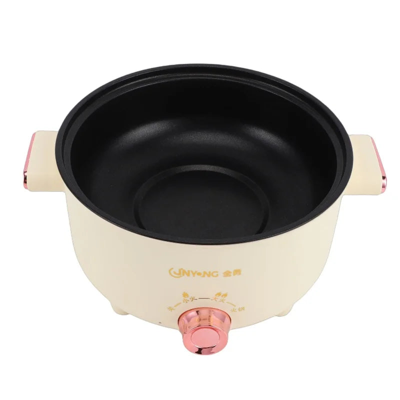 Cream electric cooking pot interior view with black nonstick bowl and front temperature dial