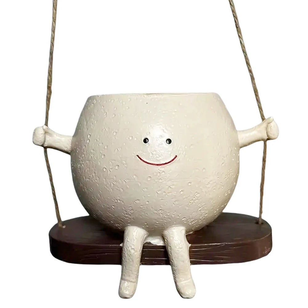 Hanging face succulent planter pot on round wooden rocker base