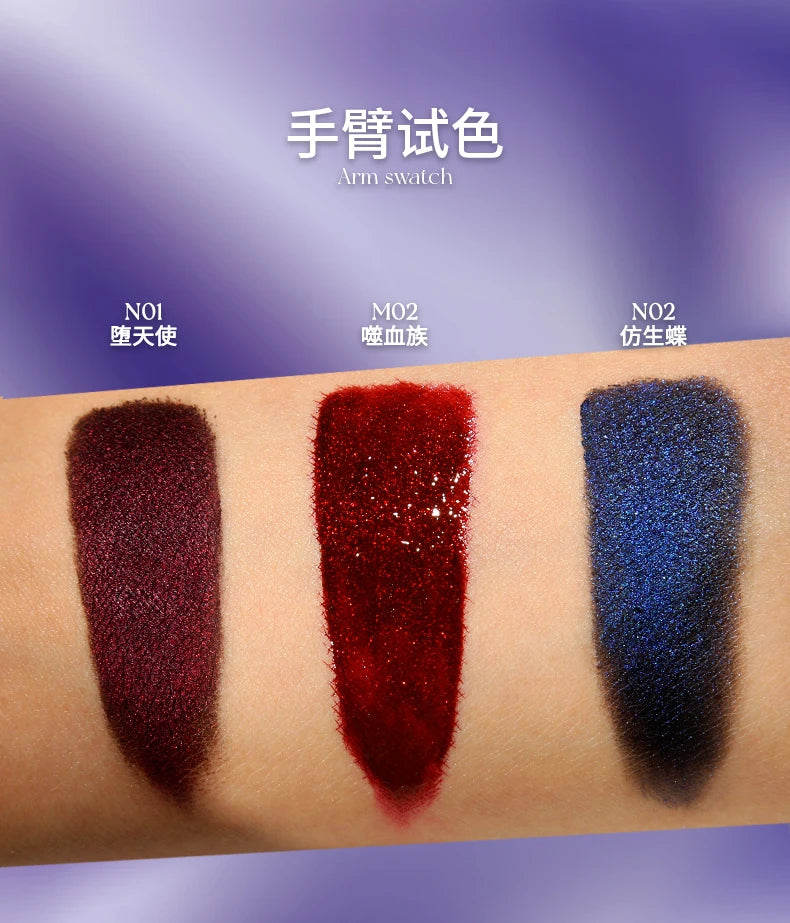 DE'LANCI shimmer lip mud arm swatches: dark red, vibrant red, and gothic blue glittery lip makeup textures.