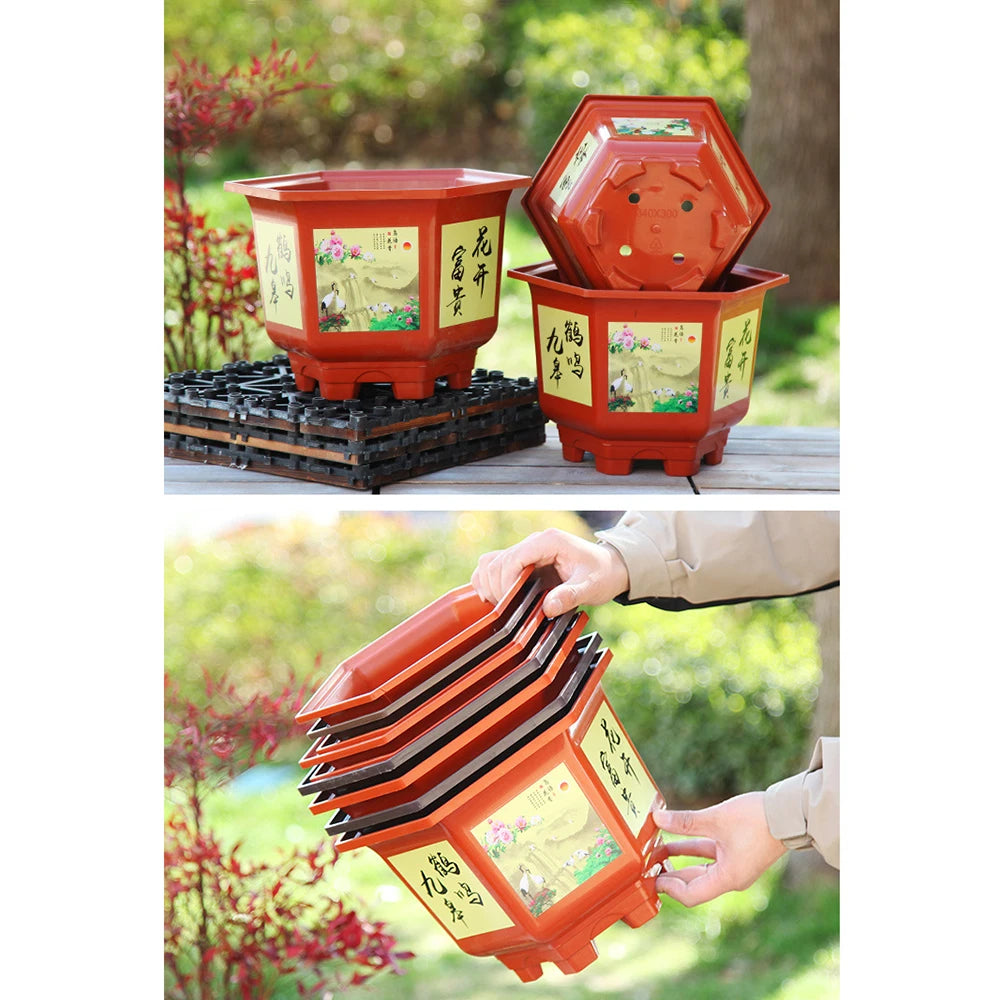 Two red illustrated resin flower pots with flared bases on a patio; one open-lid style.