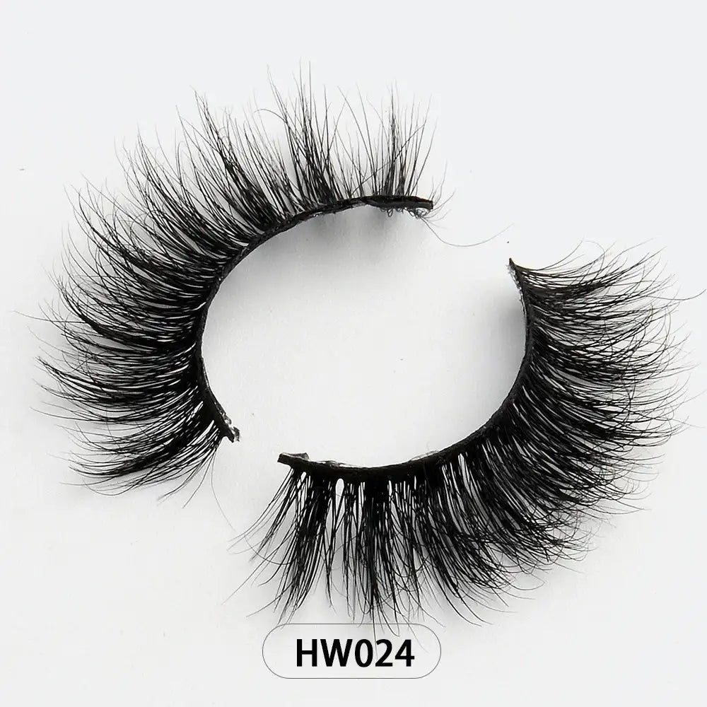 Fluffy black 3D mink false eyelashes with a flexible band, labeled HW024, isolated on a white background.