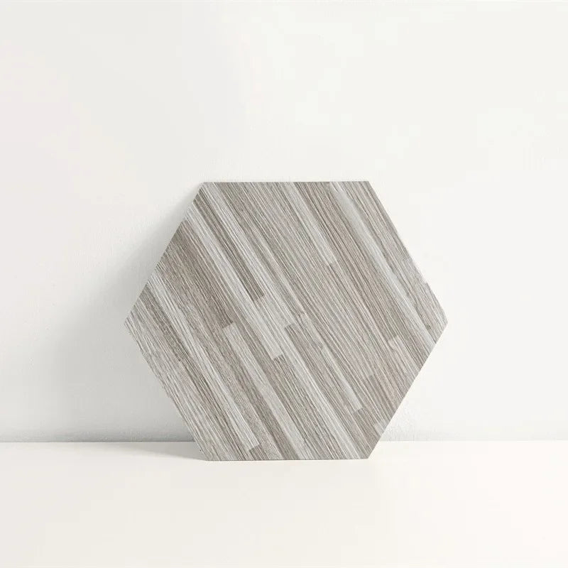 Hexagon wood-grain vinyl peel-and-stick tile, single light gray hex with wood-grain texture.
