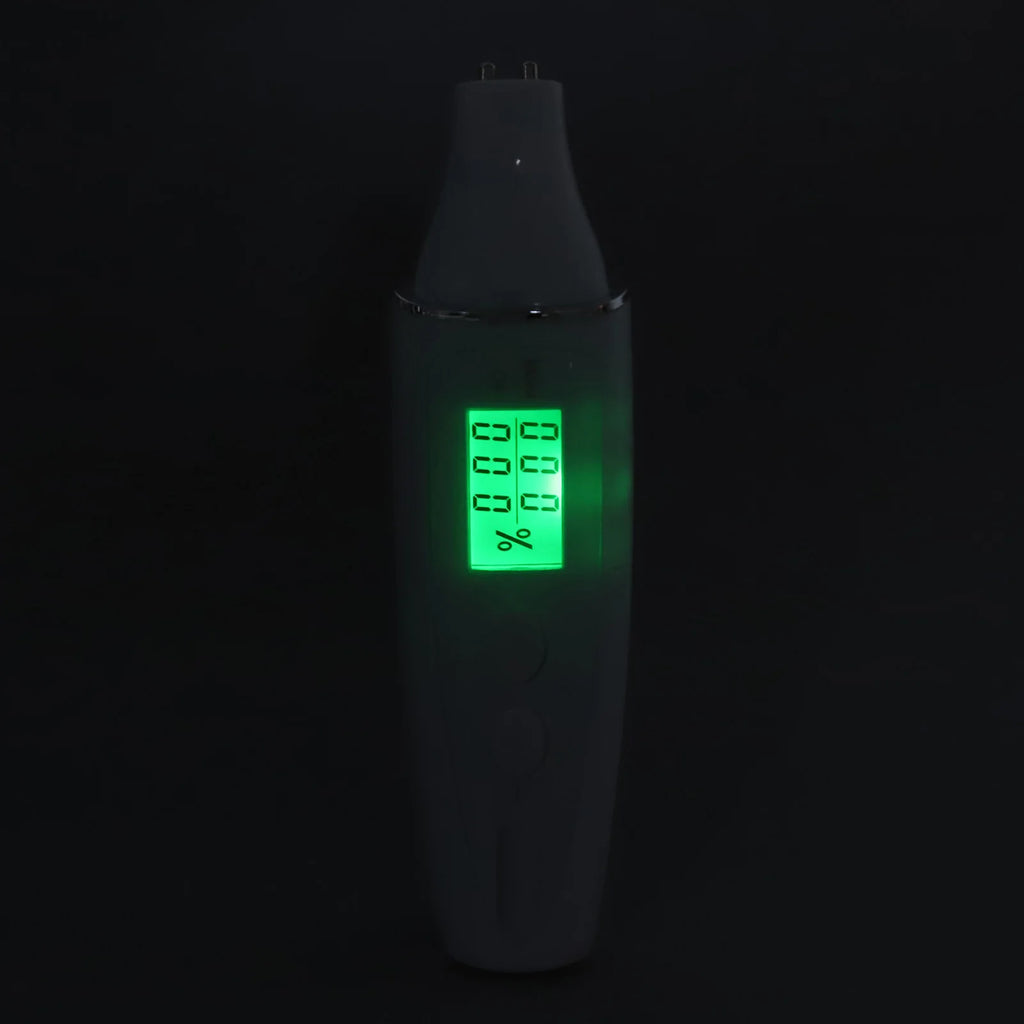 Portable facial skin analyzer pen with a glowing green digital LCD screen for measuring skin moisture levels.