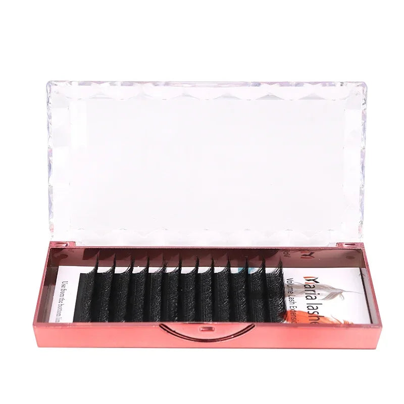 Black Maria 3D W-shaped volume lash extensions in a reflective metallic rose gold case with a clear faceted lid.
