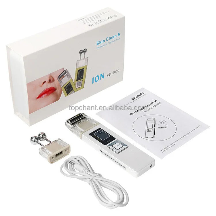 Galvanic facial device kit with white handheld unit, dual-ball massage head, charging cable, manual, and branded box.