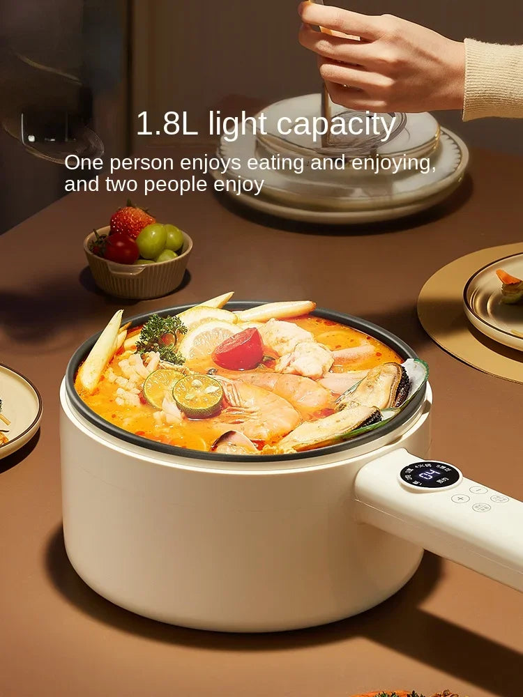 White electric cooking pot with glass lid, black inner bowl, and circular control panel
