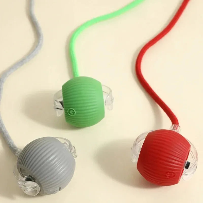 Red, green, and grey interactive rechargeable pet balls for cats and dogs with automatic rolling for active play.