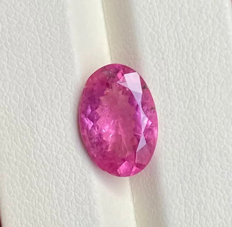 Oval-cut natural pink sapphire gemstone, loose faceted stone