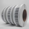 RF EAS barcode soft label roll on white backing, stacked with black barcodes