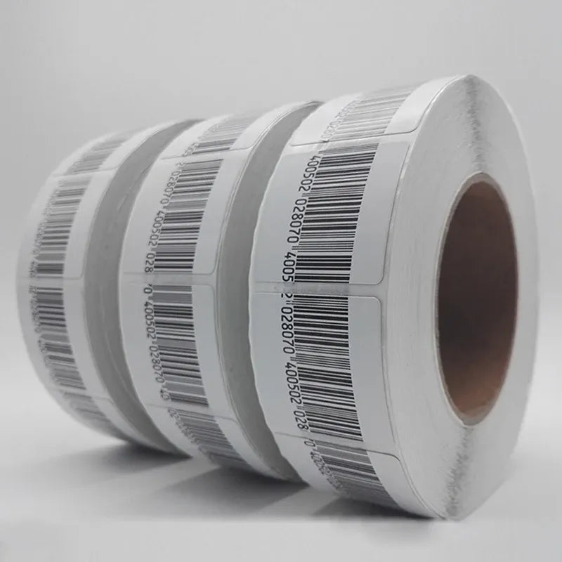 RF EAS barcode soft label roll close-up with multiple stacked black barcode labels