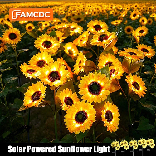 Solar-powered sunflower LED ground lights with multiple yellow blooms, glowing outdoors