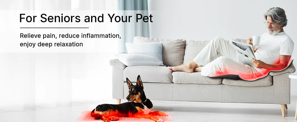 Large flexible red light therapy mat glowing red under a man on a sofa and under a dog on the floor.