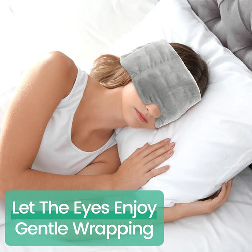 Weighted eye mask for sleeping, side angle view of soft breathable blackout mask with adjustable strap worn in bed.