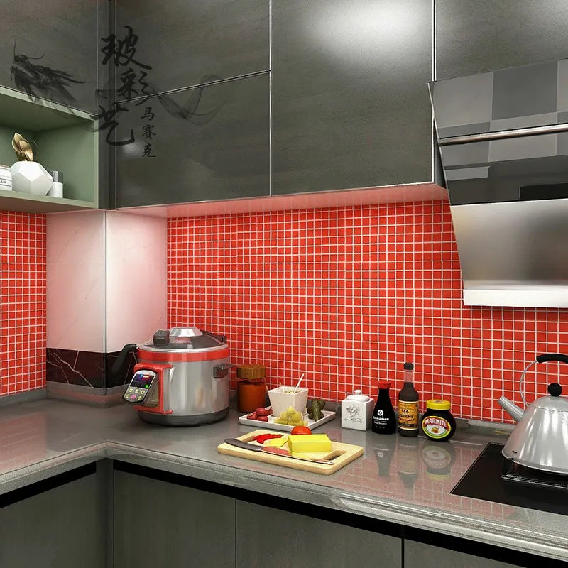 Ceramic mosaic kitchen backsplash tiles in bright red square grid pattern.