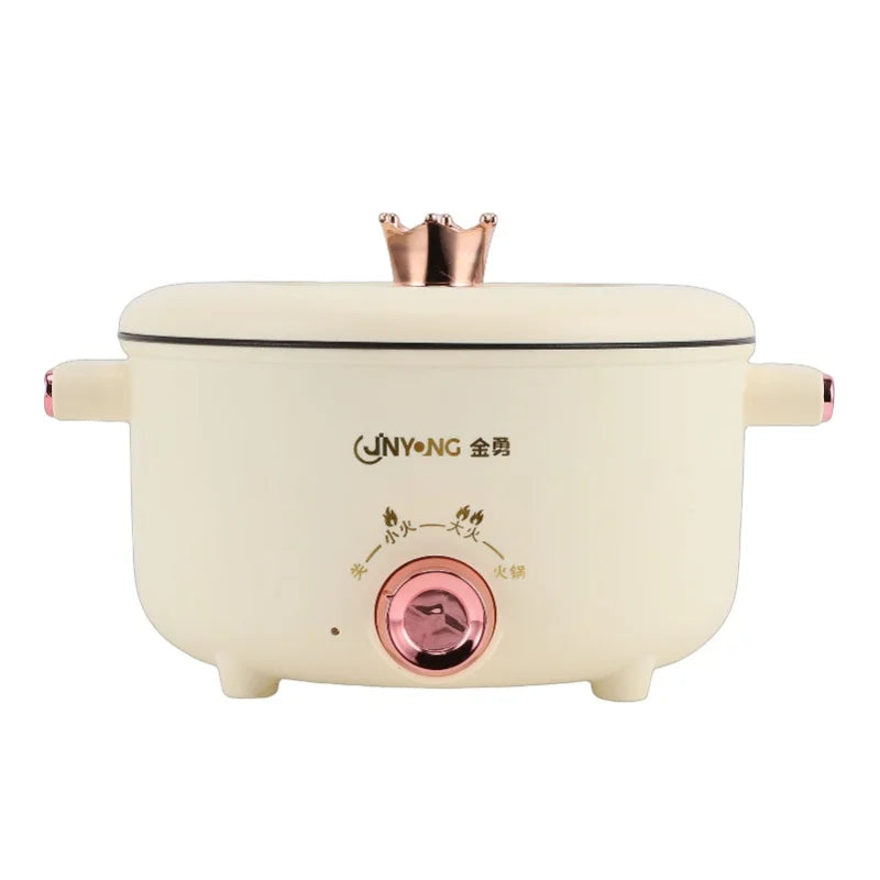 Cream electric cooking pot with copper burner top, side handles, and front temperature dial