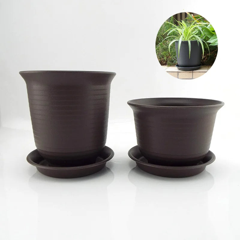 Pair of dark gray plastic plant pots with matching saucers, stackable design