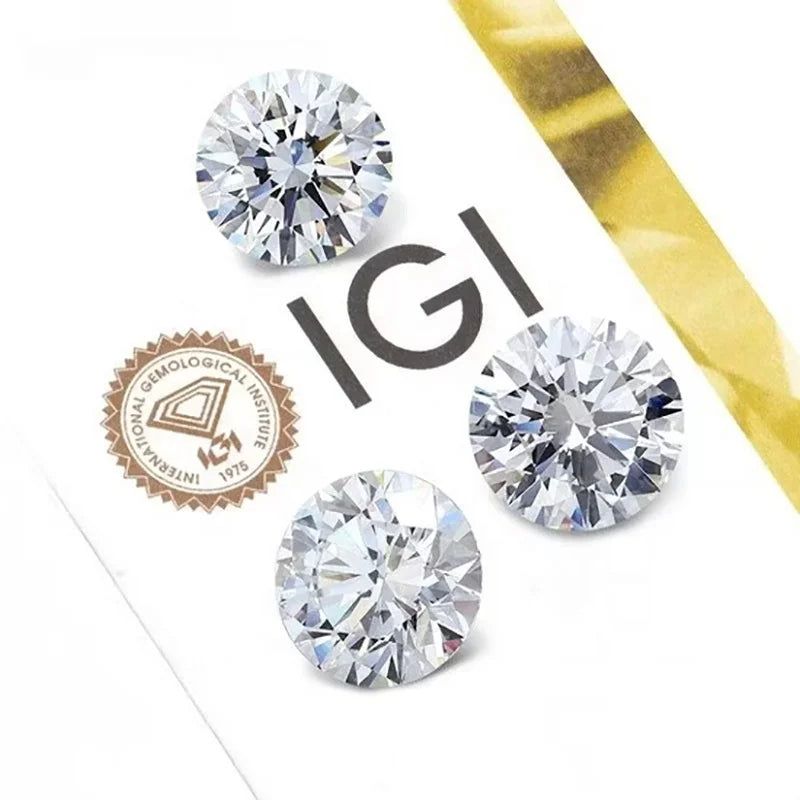 Three round lab-grown diamonds with certification logos on a white card