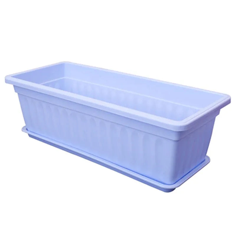 Rectangular light blue plastic planter with smooth sides and open planting tray