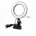16cm circular LED ring light with a black clamp base and USB power cable for desktop video calls and content creation.