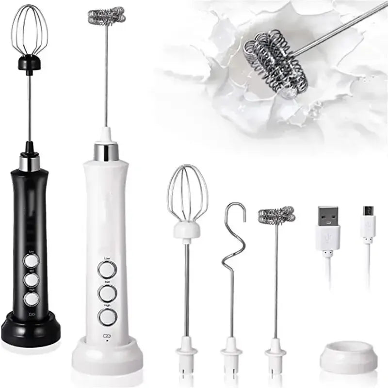 Electric handheld milk frother set in black and white with 3 stainless steel whisk heads and USB charging cable.