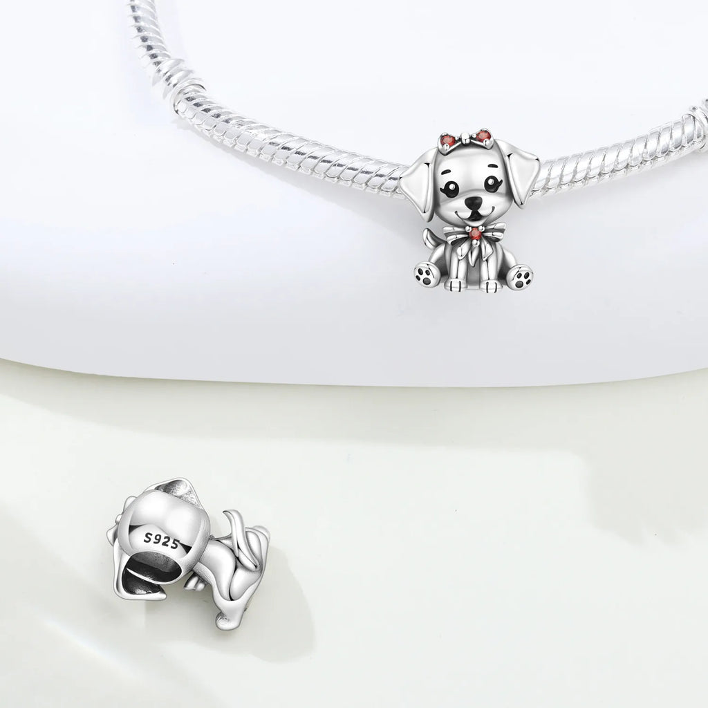 925 Sterling Silver puppy dog charm bead with bow for personalized DIY charm bracelets and pet lover jewelry gifts.