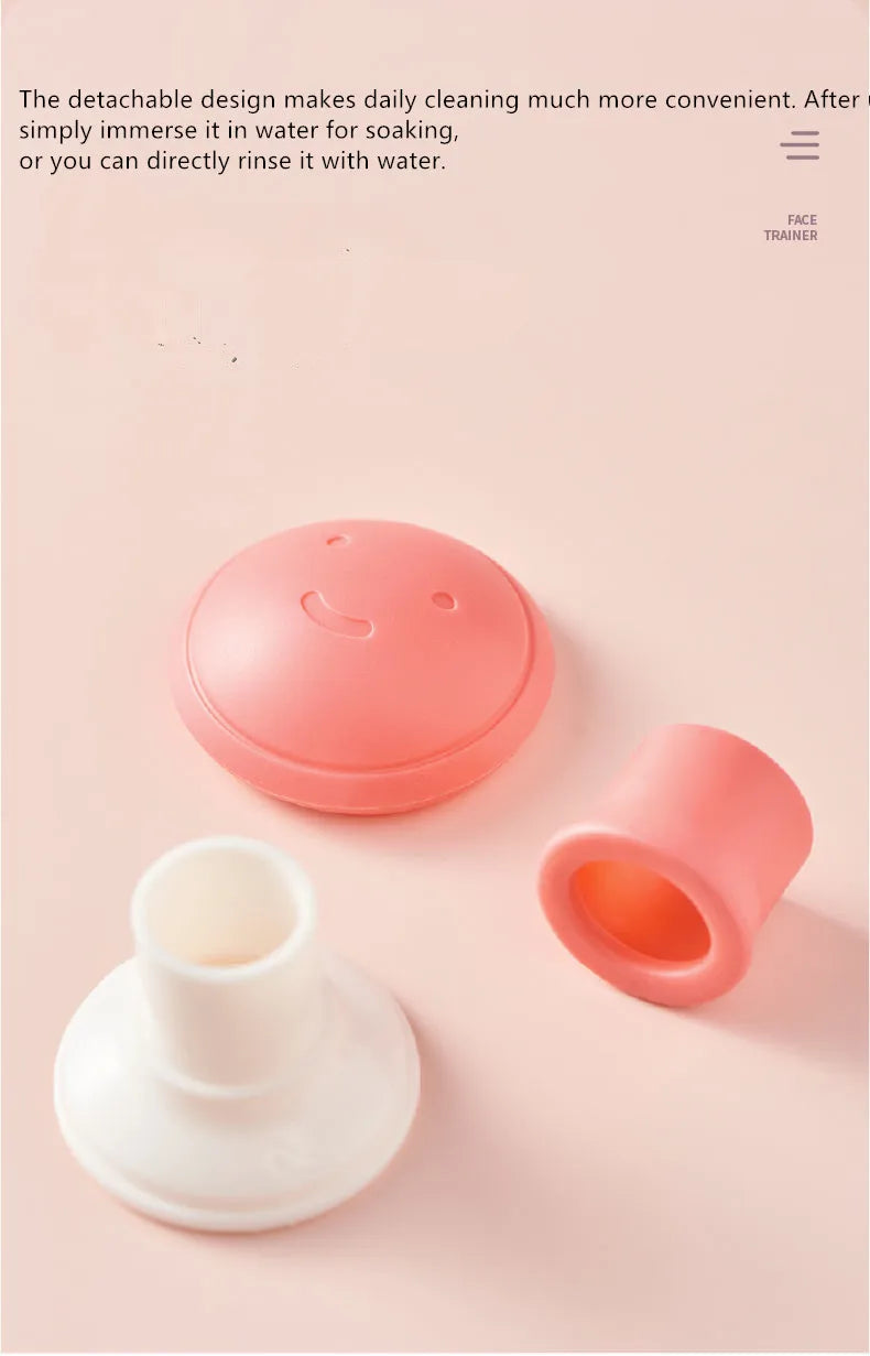 Pink and white silicone face lifting exerciser parts including a smile-faced cap and two tubular pieces on pink surface.