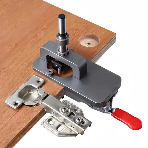Gray 35mm hinge jig drilling guide with depth stop, clamp hardware, and red handle