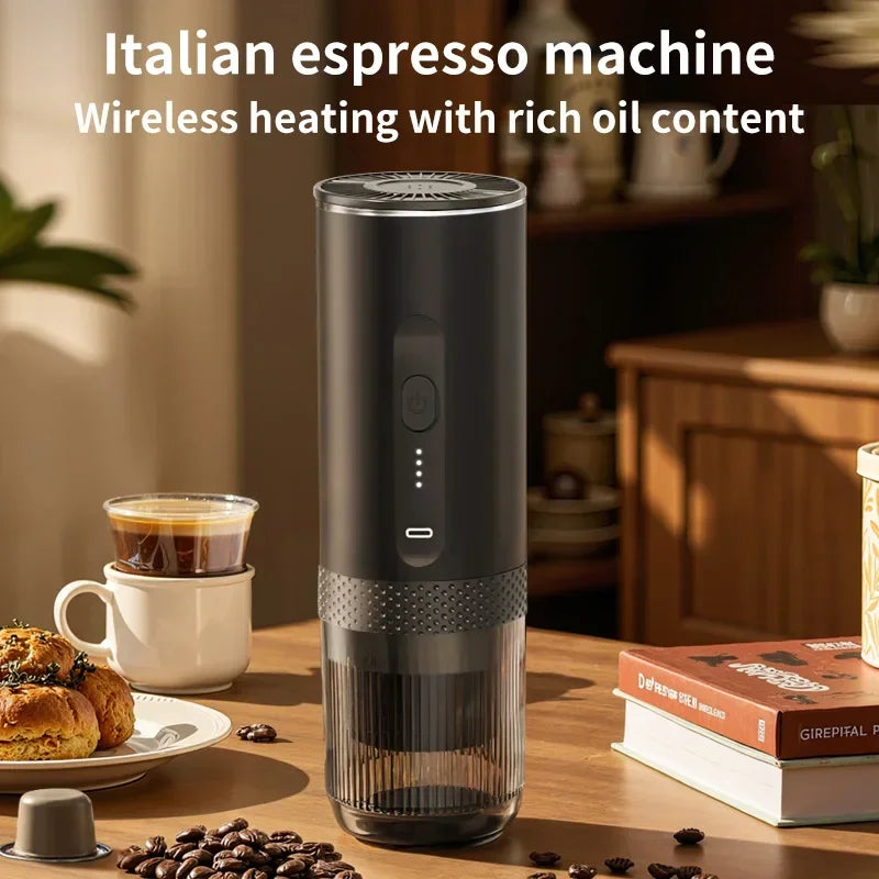Portable black wireless Italian espresso maker with LED battery indicator and clear base on a wooden table.