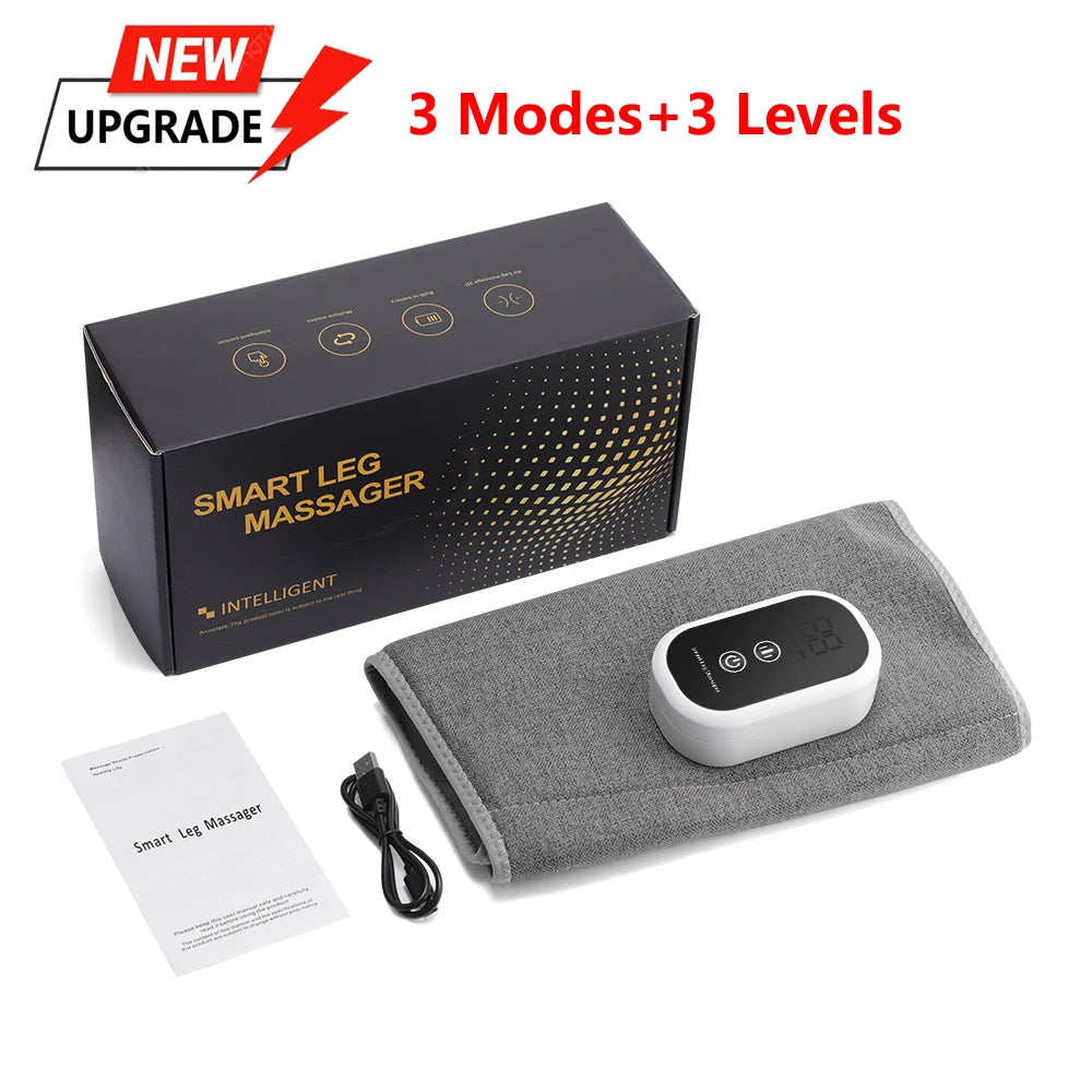 Grey fabric smart leg massager with a digital white controller, USB cable, manual, and black product box.