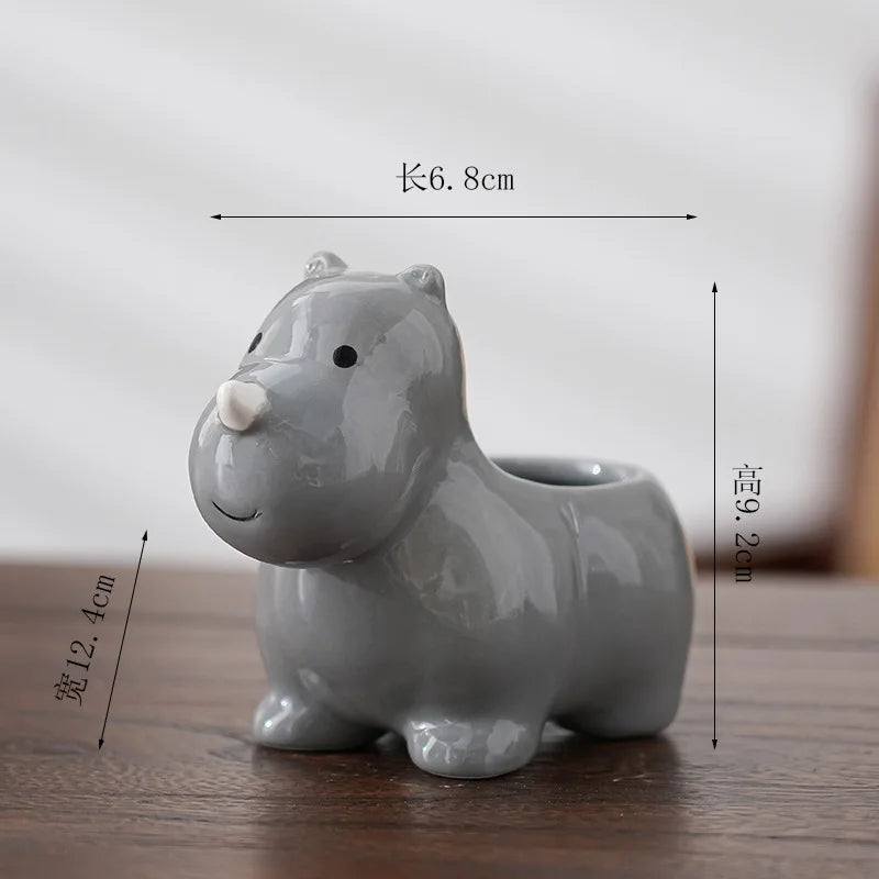 Gray animal-shaped ceramic flower pot with white muzzle and cute rounded features