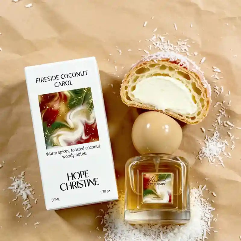 Fireside Coconut Carol 50ml perfume in a square glass bottle with a round cap next to a cream-filled pastry.