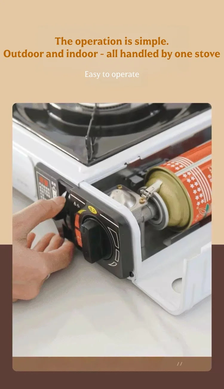 White portable cassette gas stove with hand turning control knob and gas cylinder