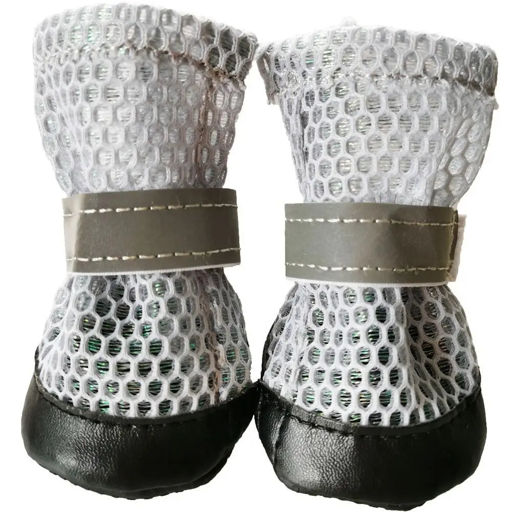 Breathable, reflective dog shoes with anti-slip soles for safe, comfortable outdoor paw protection. 4-piece set.