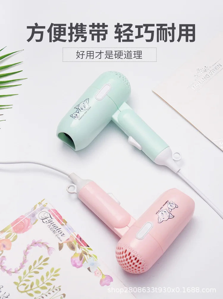 Portable mint green and pink mini folding hair dryers for travel, 400W low-power radiation-proof styling tools.