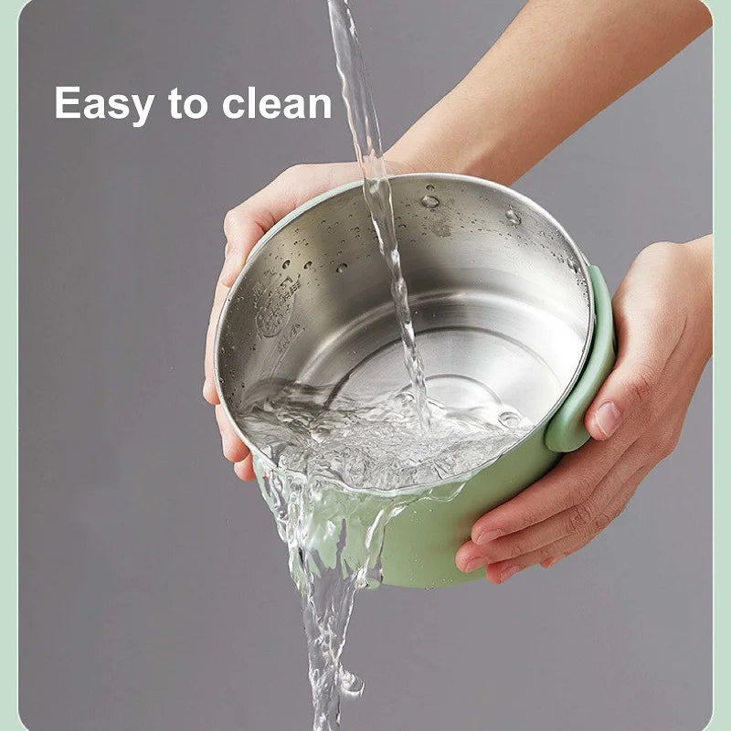 Green electric cooking pot with inner bowl, water poured in during cleaning