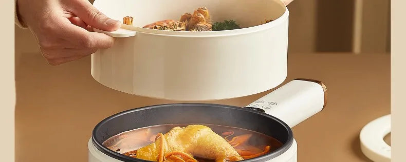 White multi-cooker pot with lid open and food visible in the inner cooking chamber