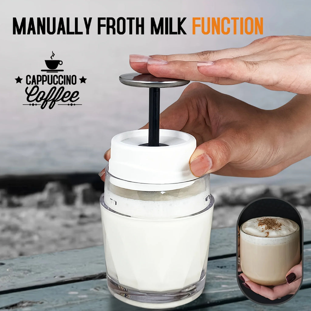 Handheld manual milk frother with clear glass carafe and white lid for making frothy cappuccino coffee at home.