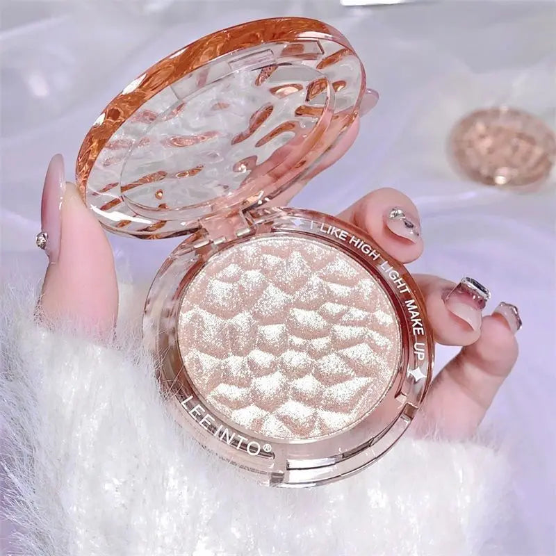 Tidesmit LEE INTO highlighter powder texture close-up featuring pearlescent fine shimmer in silky mashed potato finish