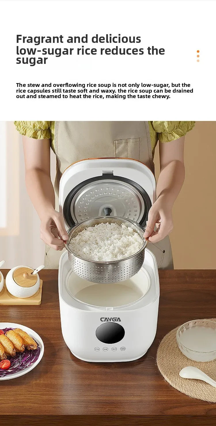 White CAYGA rice cooker with steamer basket open, hands lifting cooked rice pot