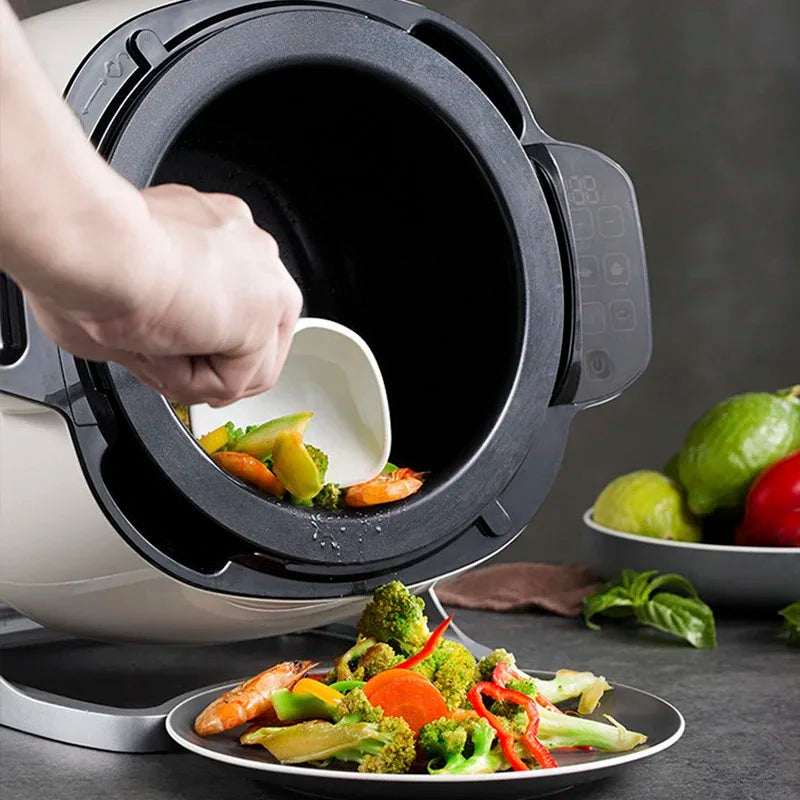Non-stick inner pot open on a countertop cooking machine, showing food ingredients