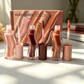 Hues Queen 3-piece hydrating lip gloss set in nude, berry, and brown shades with shiny, moisturizing textures.