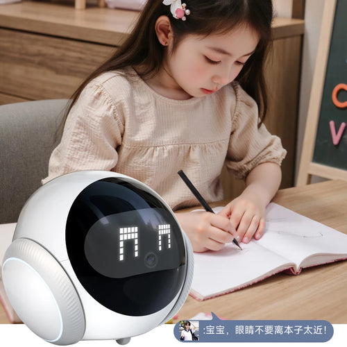 White robot camera with black lens dome, facing a child at a desk
